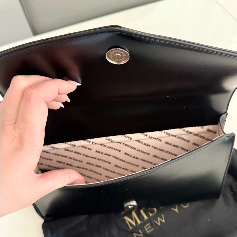 Badgley Mischka Elegant Black Clutch with Silver Accent